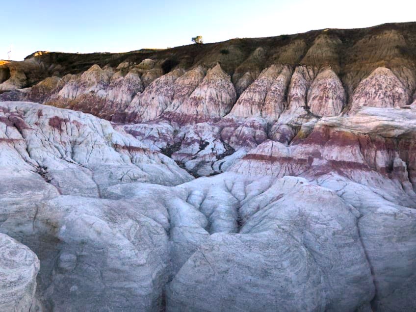 Colorful mineral-rich rock formations at the Paint Mines Interpretive Trail in Colorado. 